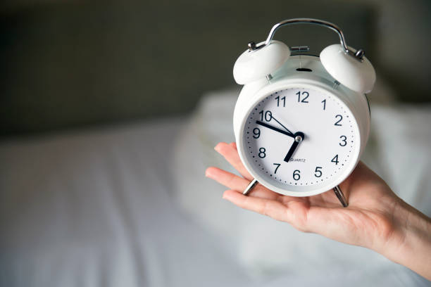 istock Person Holding Alarm Clock, It's almost seven o'clock! 640326148