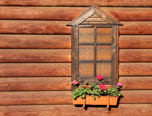 istock window and the wall of the log house 640326310