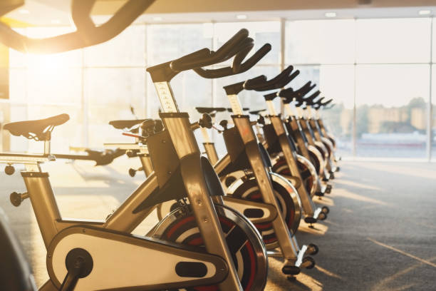 istock Modern gym interior with equipment, fitness exercise bikes 640326736