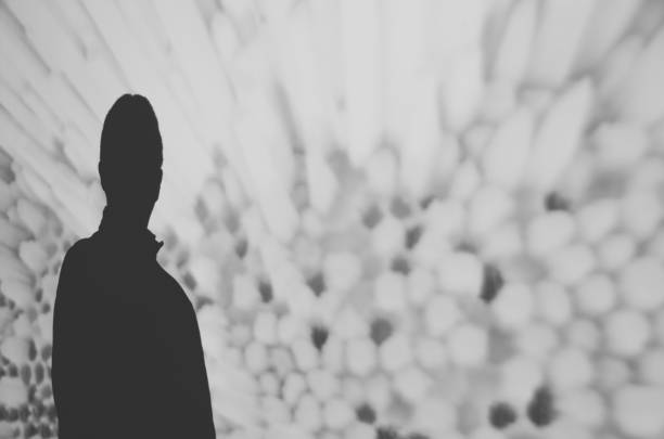 istock Silhouette of a man against a wall 640329120