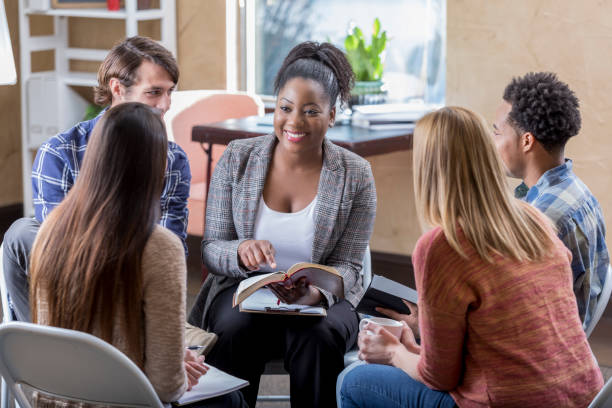 istock Beautiful African American leads diverse Bible study group 640332094