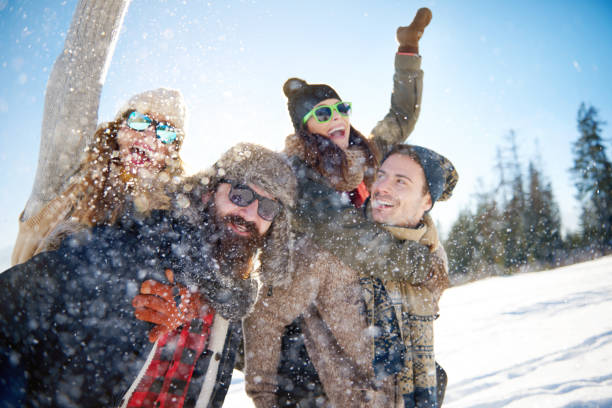 istock Friends having fun in the snow 640332150