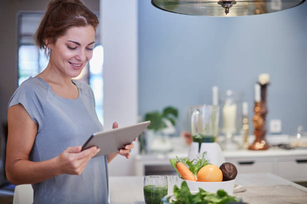 istock Preparing a green smoothie at home. 640332354