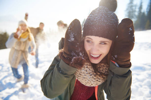 istock Woman about to be hit with a snowball 640332648