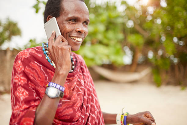 istock Elegant Maasai man using a smartphone. 640333470