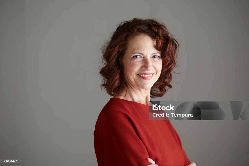 Woman headshot looking at camera. Women Stock Photo