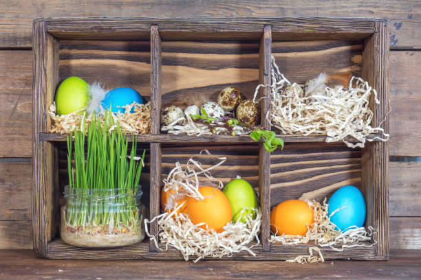 istock Colorful chicken eggs, quail eggs, green wheat 640333826