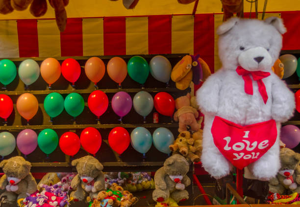 istock stand with teddy bears and colorful balloons 640334306