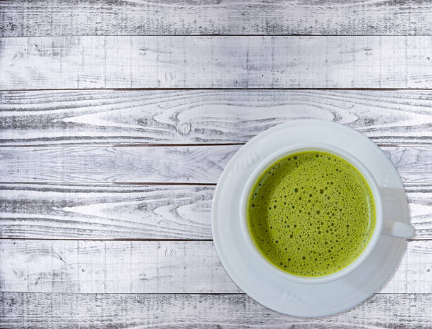 istock hot green tea on the table, flat lay 640335082