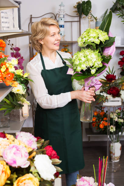 istock Florist with fresh flowers 640337336