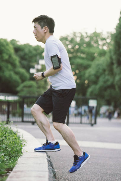 Japanese sport man exercising in a park