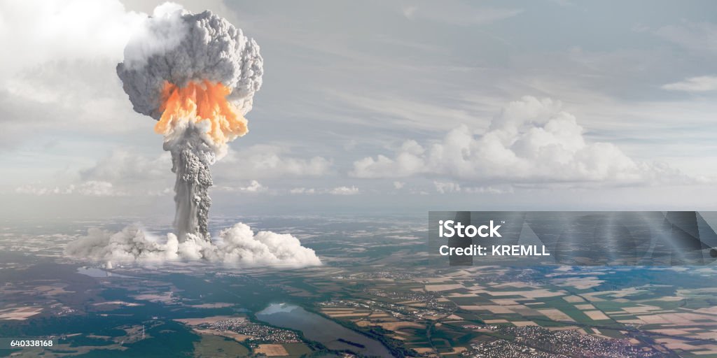 Nuclear explosion from height of bird's flight. The terrible nuclear explosion with cloud height. Nuclear Weapon Stock Photo