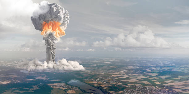 Nuclear explosion from height of bird's flight. The terrible nuclear explosion with cloud height. nuclear energy stock pictures, royalty-free photos & images