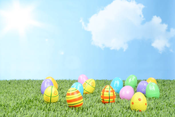 field of colorful easter eggs with sun