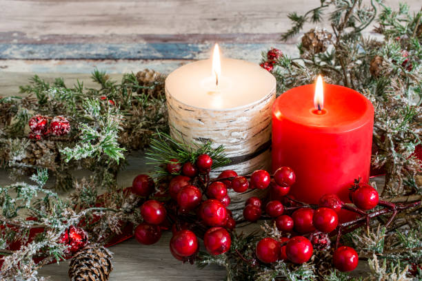 istock Still life of three candles burning with green branches 640338696