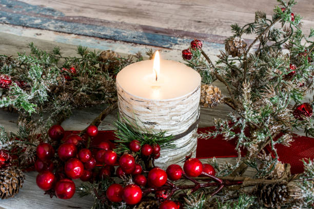 istock Still life of three candles burning with green branches 640338990