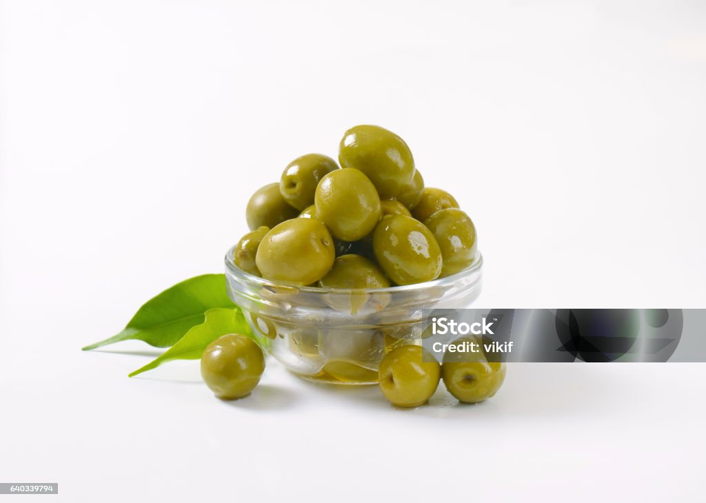 bowl of green olives bowl of green olives on white background Olive - Fruit Stock Photo
