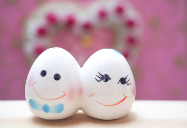 Ceramic doll cute couple on heart background
