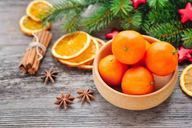 istock Tangerines and Christmas tree branches on a wooden table. Natura 640341434