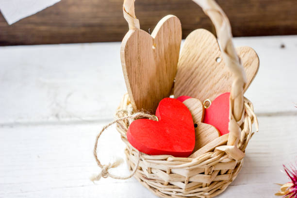 istock Bascket with wooden hearts 640345298