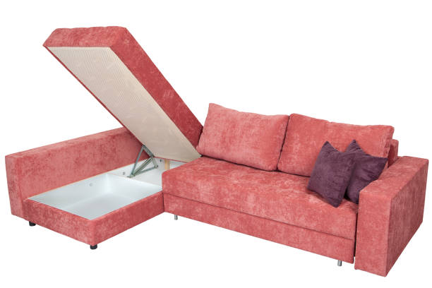 istock Corner sofa-bed of pink with storage system,  isolated on white. 640346916
