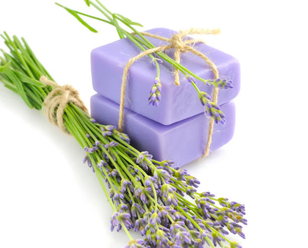 istock Handmade soap and lavender flowers on a white background 640352200