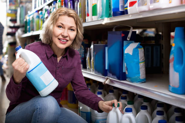 istock Smiling female with selecting fabric conditioner 640353068