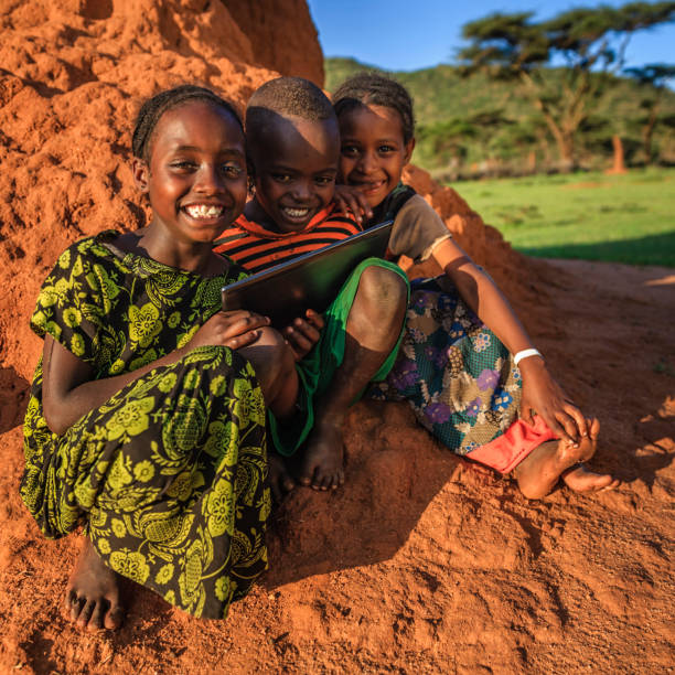 istock Little African children using digital tablet, East Africa 640353590