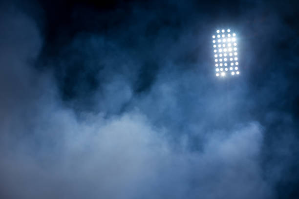 istock stadium lights and smoke 640666136