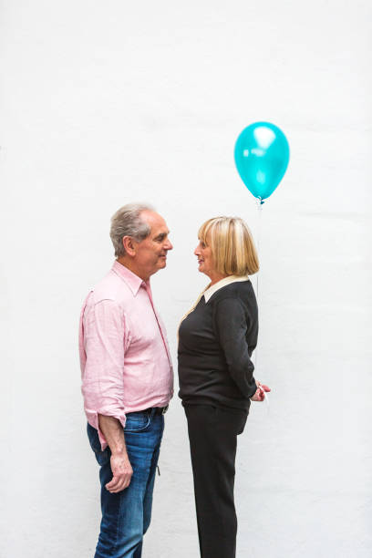 istock Loving Happy Active Senior Couple Playing With Balloons 640783976