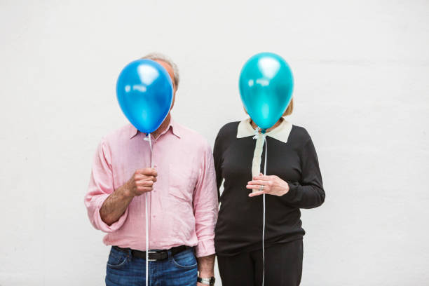 istock Loving Happy Active Senior Couple Playing With Balloons 640784014