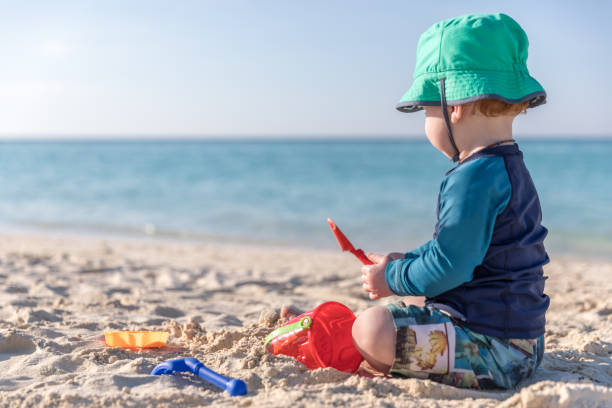 istock Baby Boy Playing on Tropical Beach, Cayo Coco, Cuba 640807062