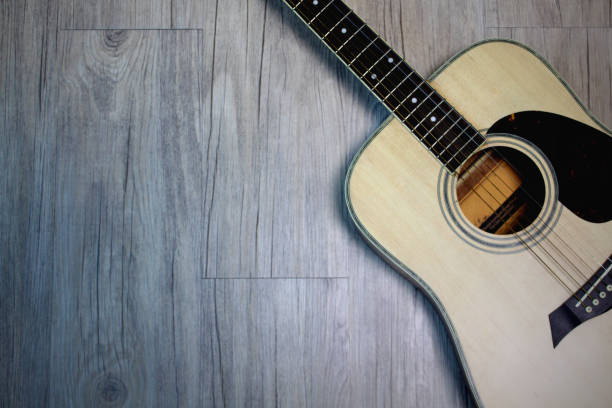 istock Acoustic guitar on wooden 640830832