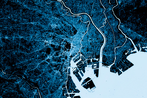 Blue toned Satellite Image of Tokyo, Japan. Digital Composite.\