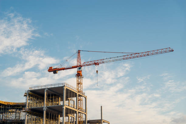 istock Crane and building construction in sunrise light 640833060
