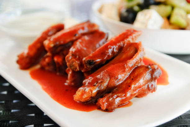 istock Chicekn wings with red sauce 640834176