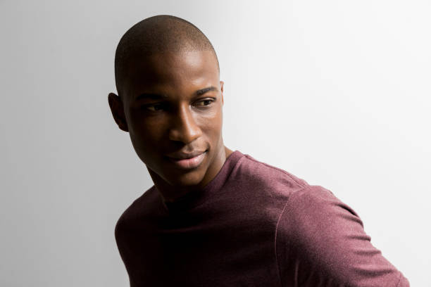 istock Confident young man against white background 640834630