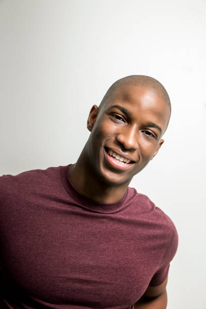 istock Portrait of smiling man against white background 640834670