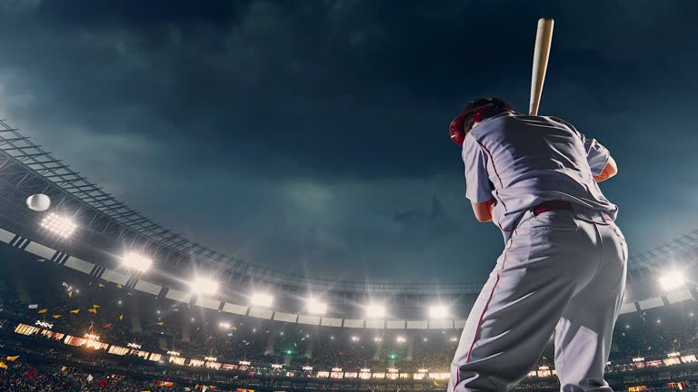 Baseball batter hitting ball during game