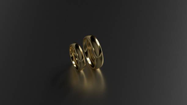 istock The beauty gold wedding rings on black background. 3d rendering 640840528