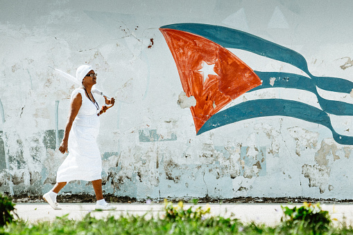 Senior woman walking the streets of Old Havana. Cuba.