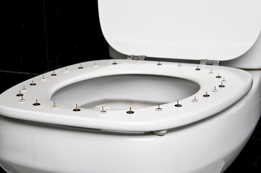 Adjust the water level float in the toilet flush cistern yourself.