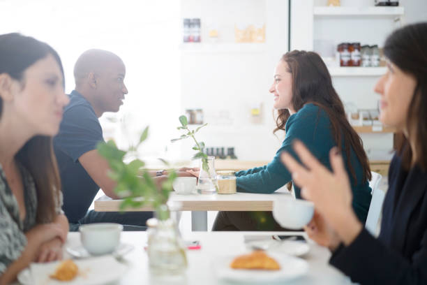 istock Loving young couple holding hands at cafe table 640878374