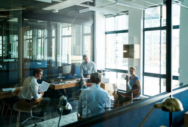 istock Business people brainstorming in board room 640882528