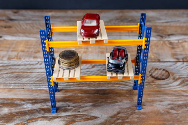 Two miniature cars and some coins