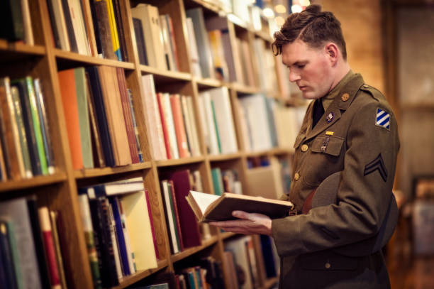 WWII US Soldier Reading In A Public Library stock photo