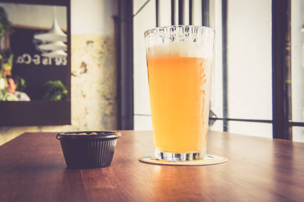 Beer glass on the bar counter vintage filter