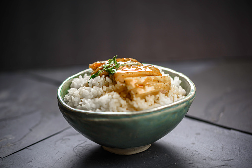 Grilled chicken over white rice with teriyaki sauce