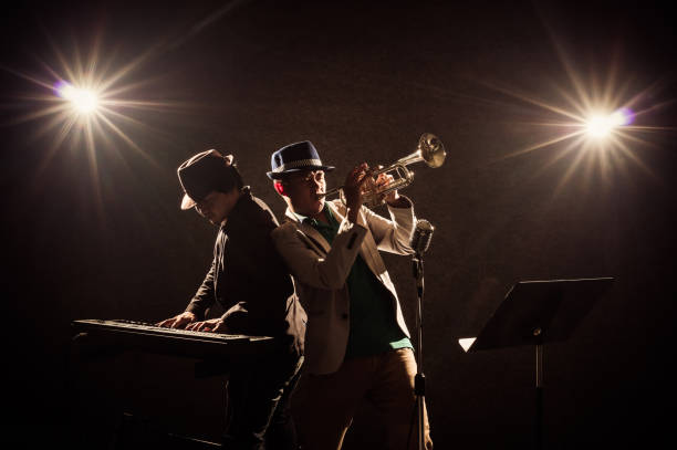 istock musical concept, Musicians playing a Trumpet and keyboard 640907486