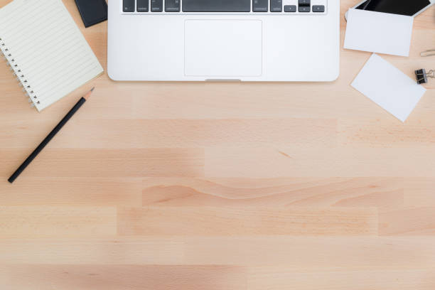 istock Office table with notepad, computer, pencil and business cards. View from above with copy space 640908350